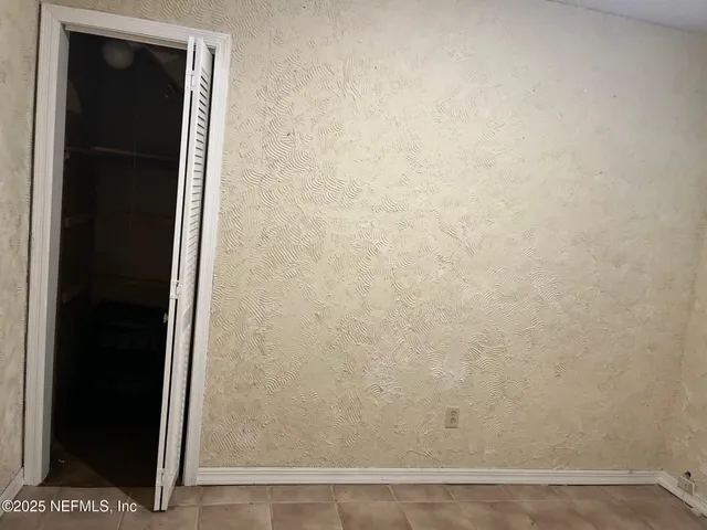 an empty room with wooden floor