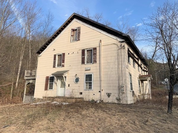 6 Greenfield Road Colrain, MA 01340 - Photo 1 of 24 a view of a white house with a large windows