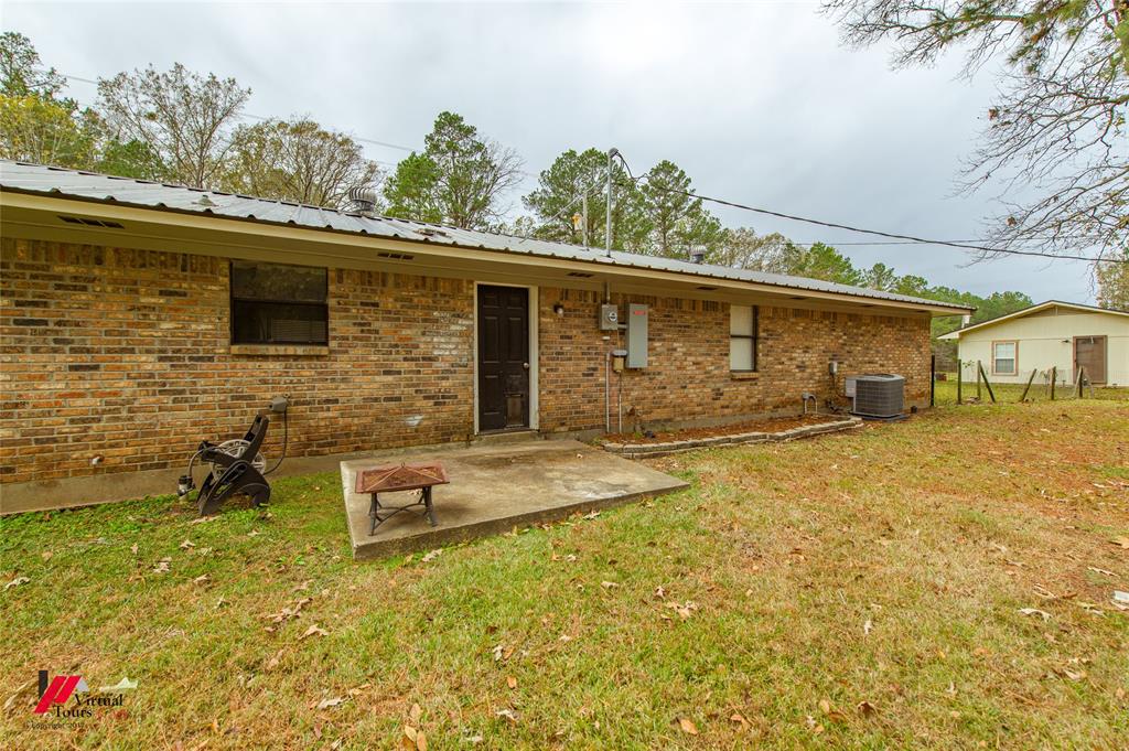 198 7 Pines Road Benton, LA 71006 - Photo 27 of 30 a front view of a house with yard