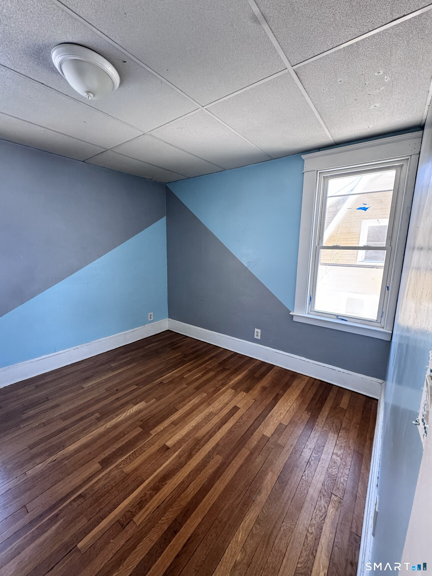 269 Helen Street Hamden, CT 06514 - Photo 14 of 16 a view of an empty room and wooden floor