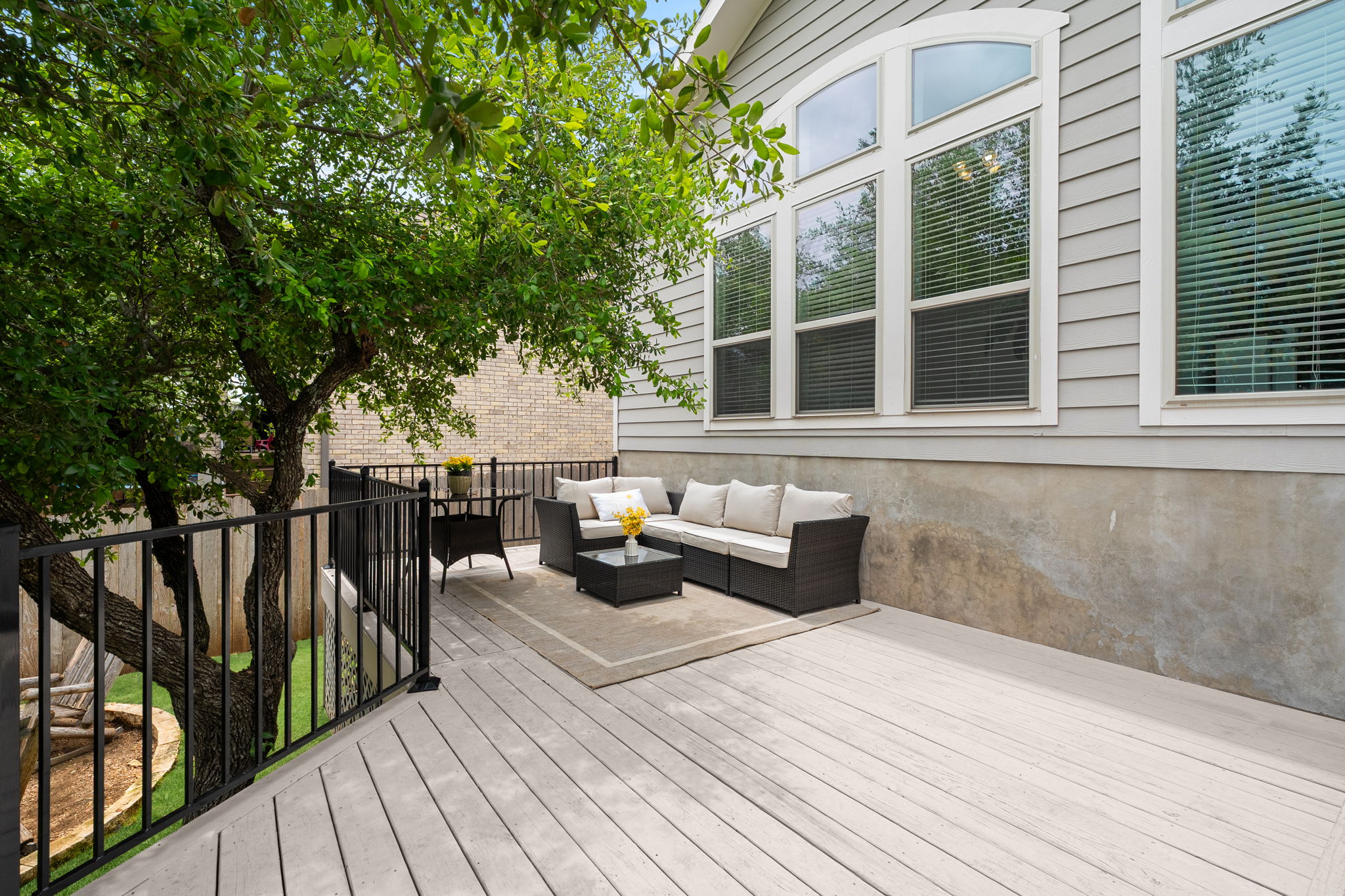 1908 Woolsey Way Leander, TX 78641 - Photo 23 of 36 A spacious wooden deck provides ample room for outdoor lounging and enjoying the natural surroundings.
