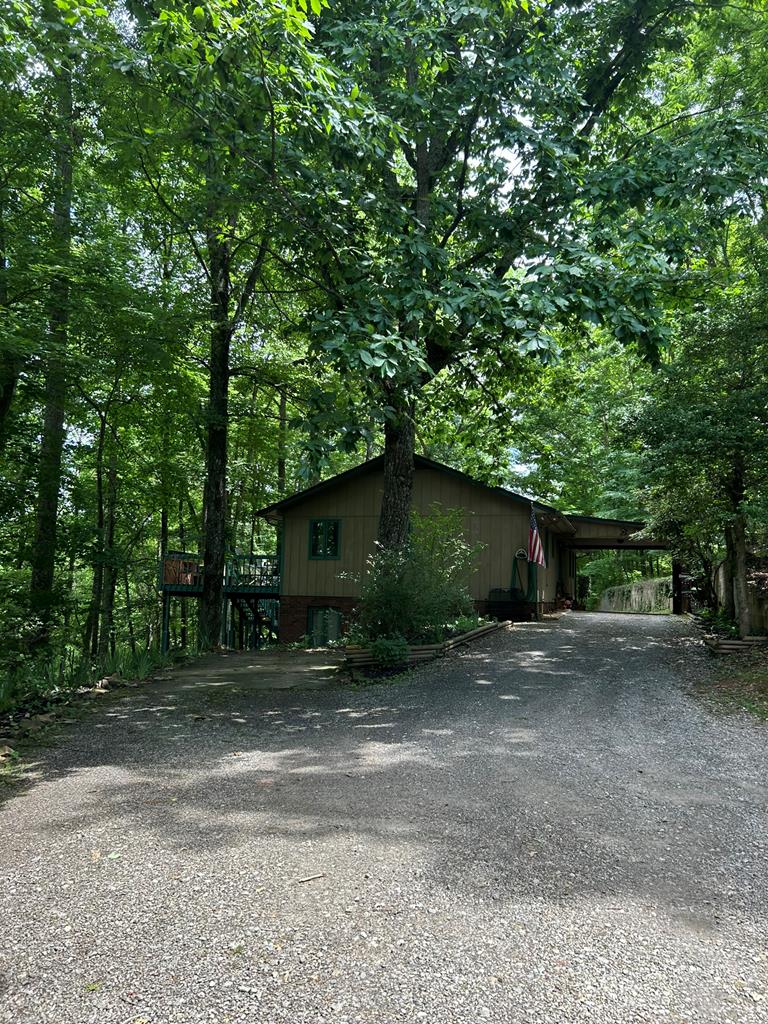 a view of a house with a tree