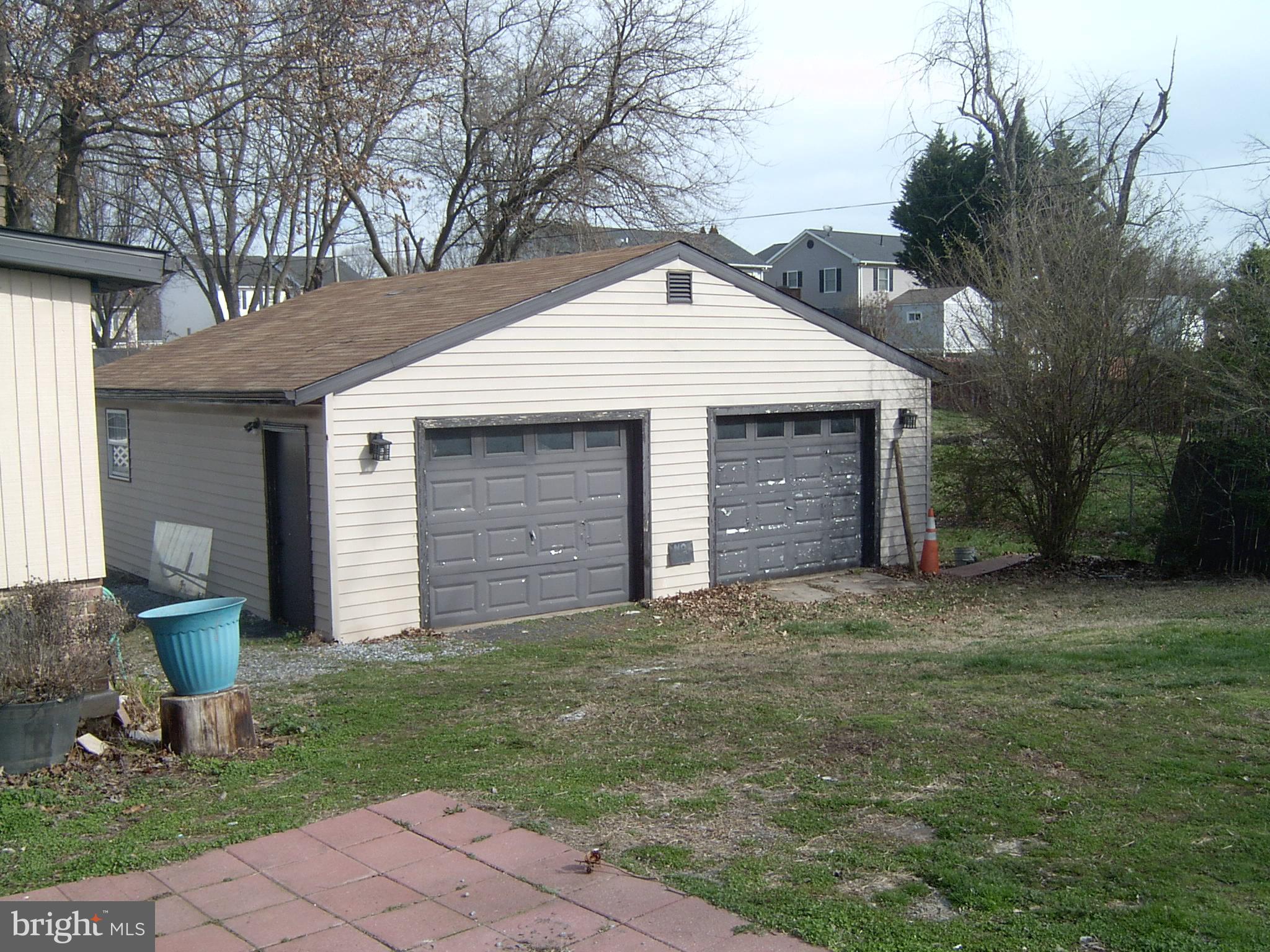602 North Reymann Street Ranson, WV 25438 - Photo 2 of 44 a front view of a house with a yard and garage