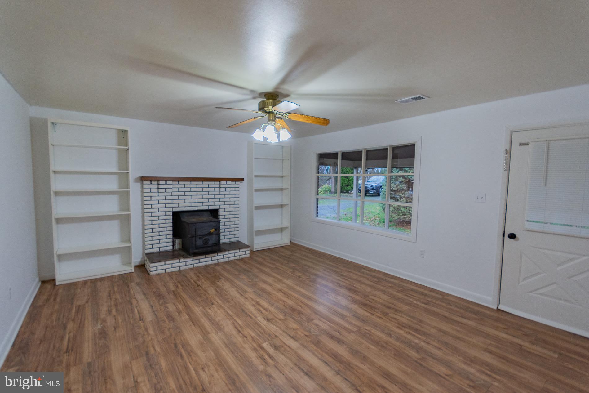 602 North Reymann Street Ranson, WV 25438 - Photo 4 of 44 wooden floor fireplace and natural light in room