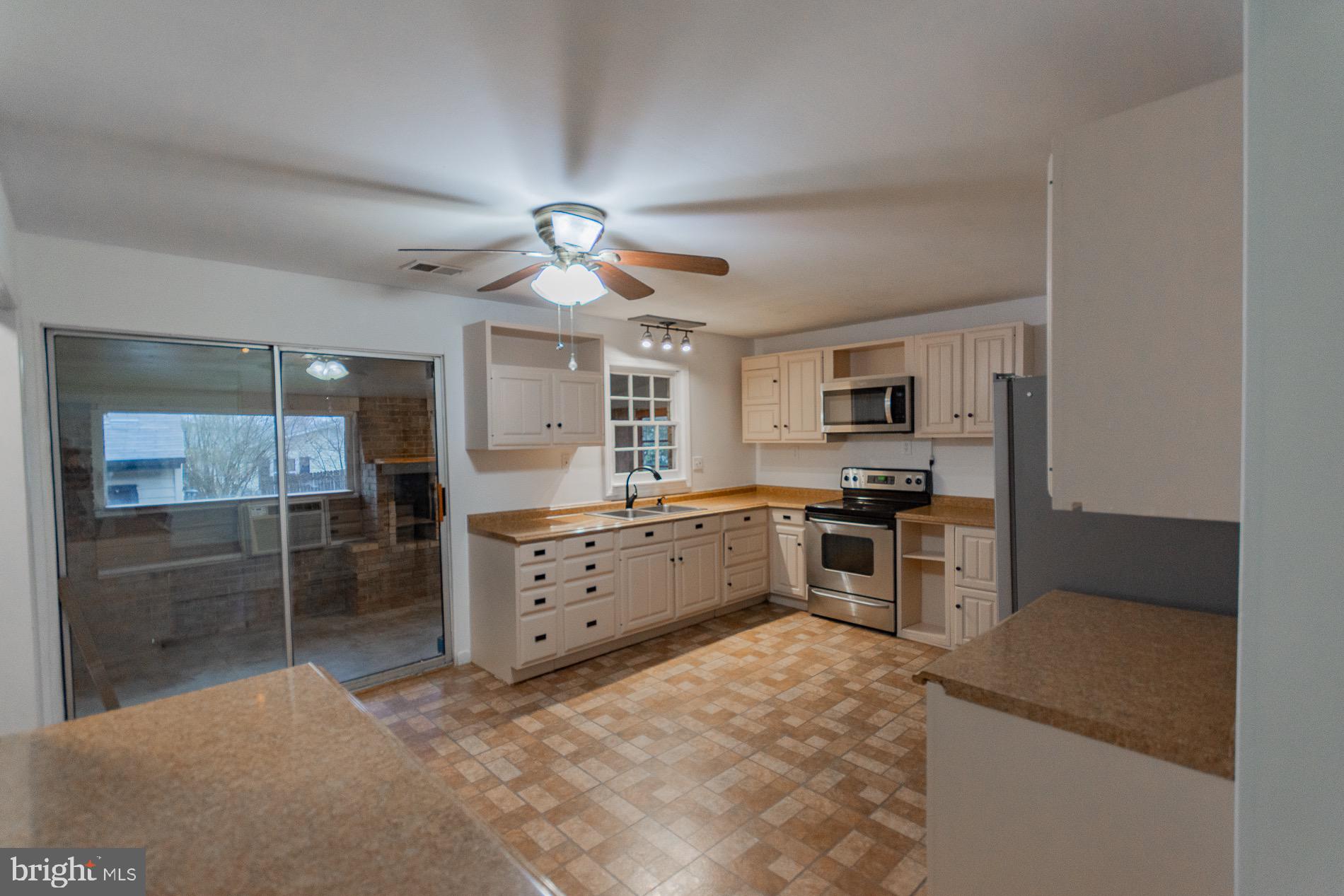 602 North Reymann Street Ranson, WV 25438 - Photo 7 of 44 a large kitchen with kitchen island a sink stainless steel appliances and cabinets