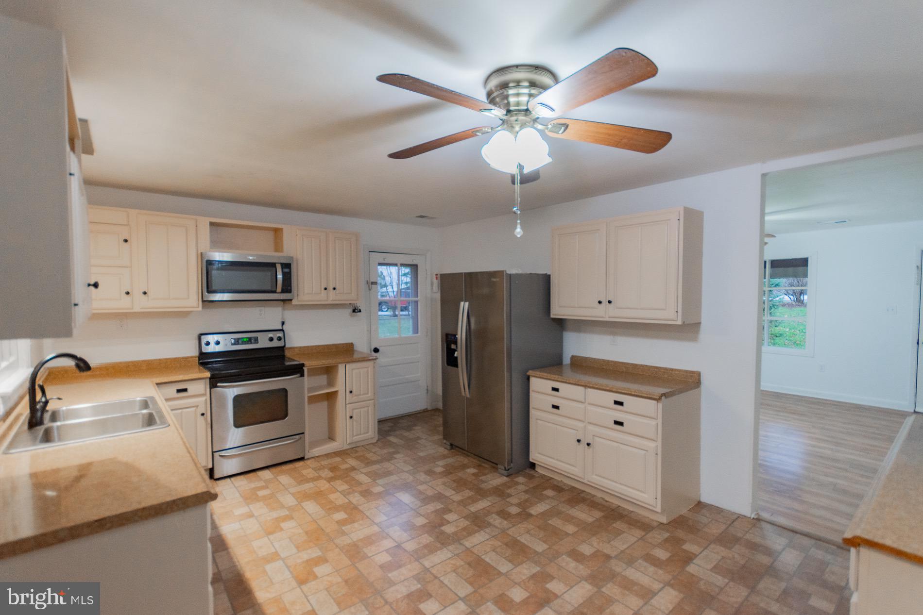 602 North Reymann Street Ranson, WV 25438 - Photo 8 of 44 a kitchen with stainless steel appliances granite countertop a refrigerator a stove top oven a sink and dishwasher