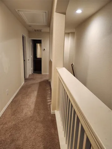 a bedroom with a bed and a mirror