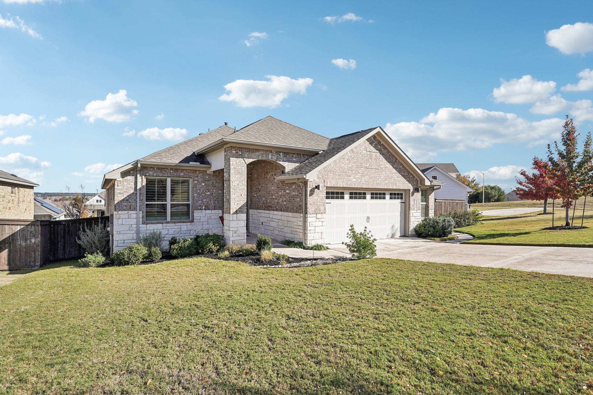 1920 Muhly Bush Bend Leander, TX 78641 - Photo 1 of 1 a view of a house next to a big yard with large trees