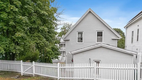 an aerial view of house with yard