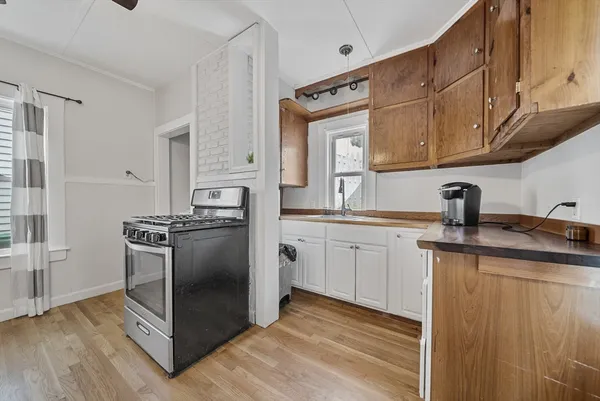 a kitchen with a sink cabinets and stainless steel appliances