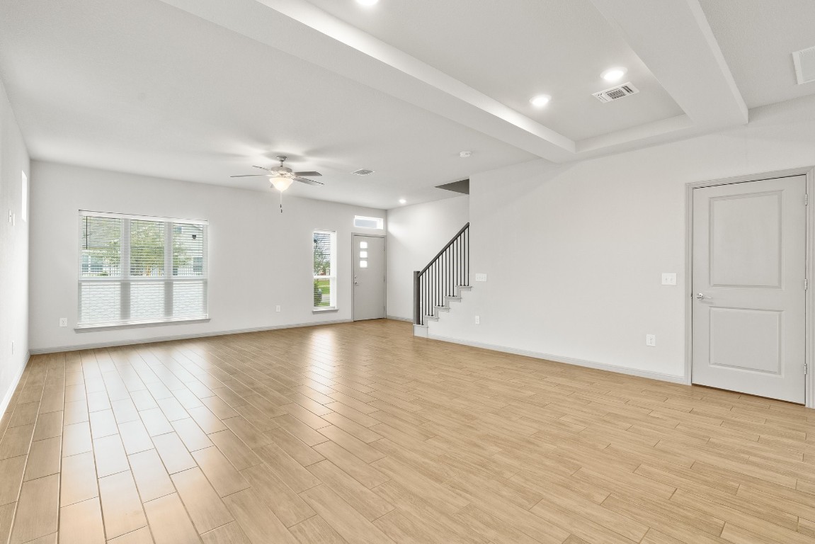 5913 B Charles Merle Dr., Unit 16 Austin, TX 78747 - Photo 11 of 35 an empty room with wooden floor and windows