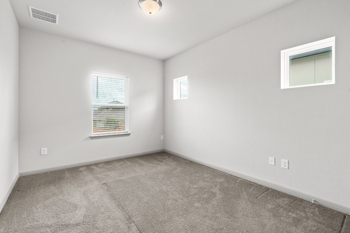 5913 B Charles Merle Dr., Unit 16 Austin, TX 78747 - Photo 13 of 35 an empty room with windows