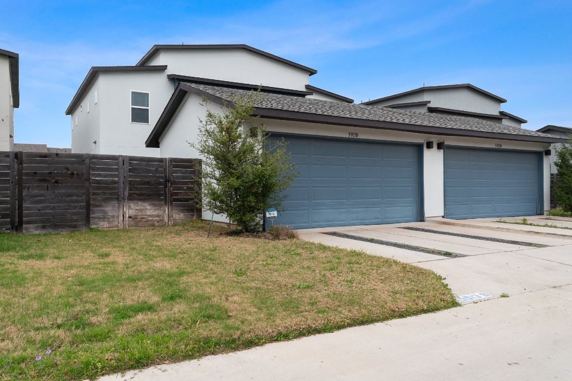 5913 B Charles Merle Dr., Unit 16 Austin, TX 78747 - Photo 26 of 35 a front view of a house with a garage