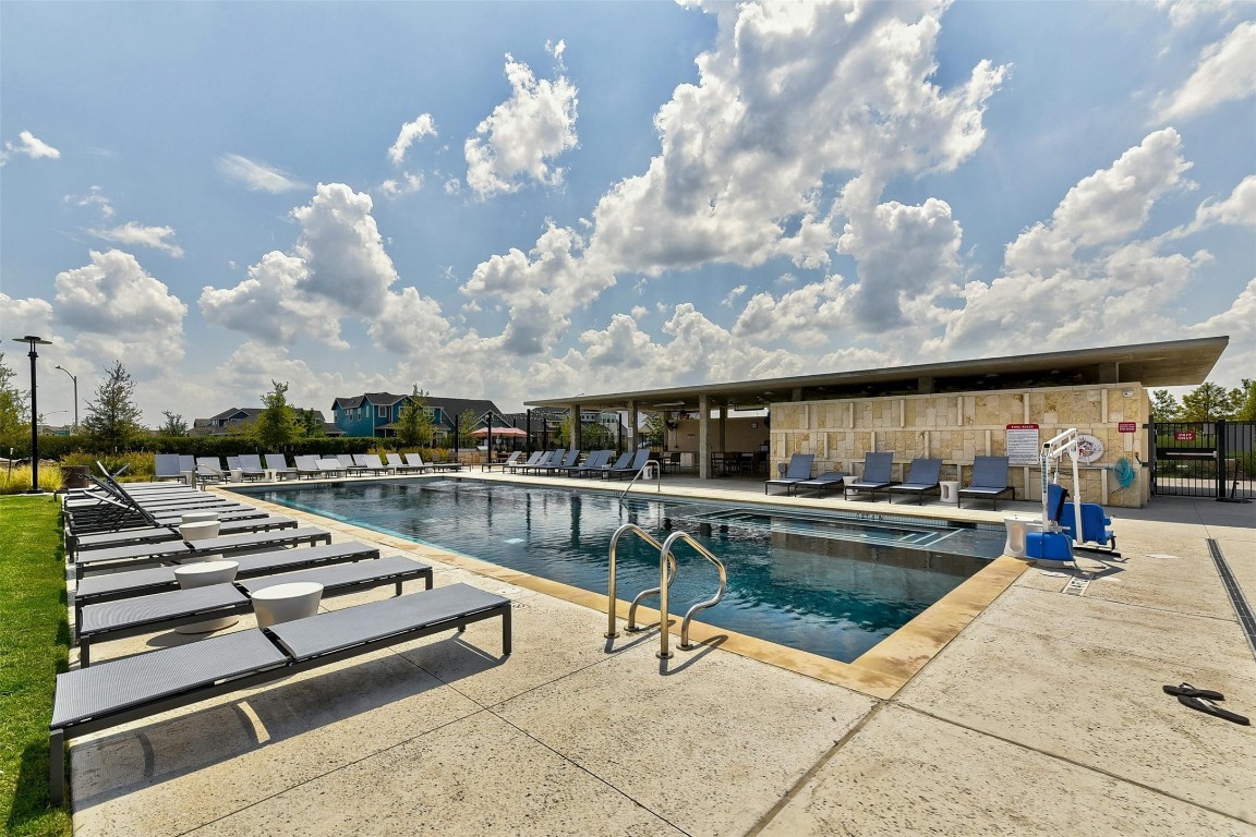 5913 B Charles Merle Dr., Unit 16 Austin, TX 78747 - Photo 30 of 35 a view of a swimming pool with lounge chair