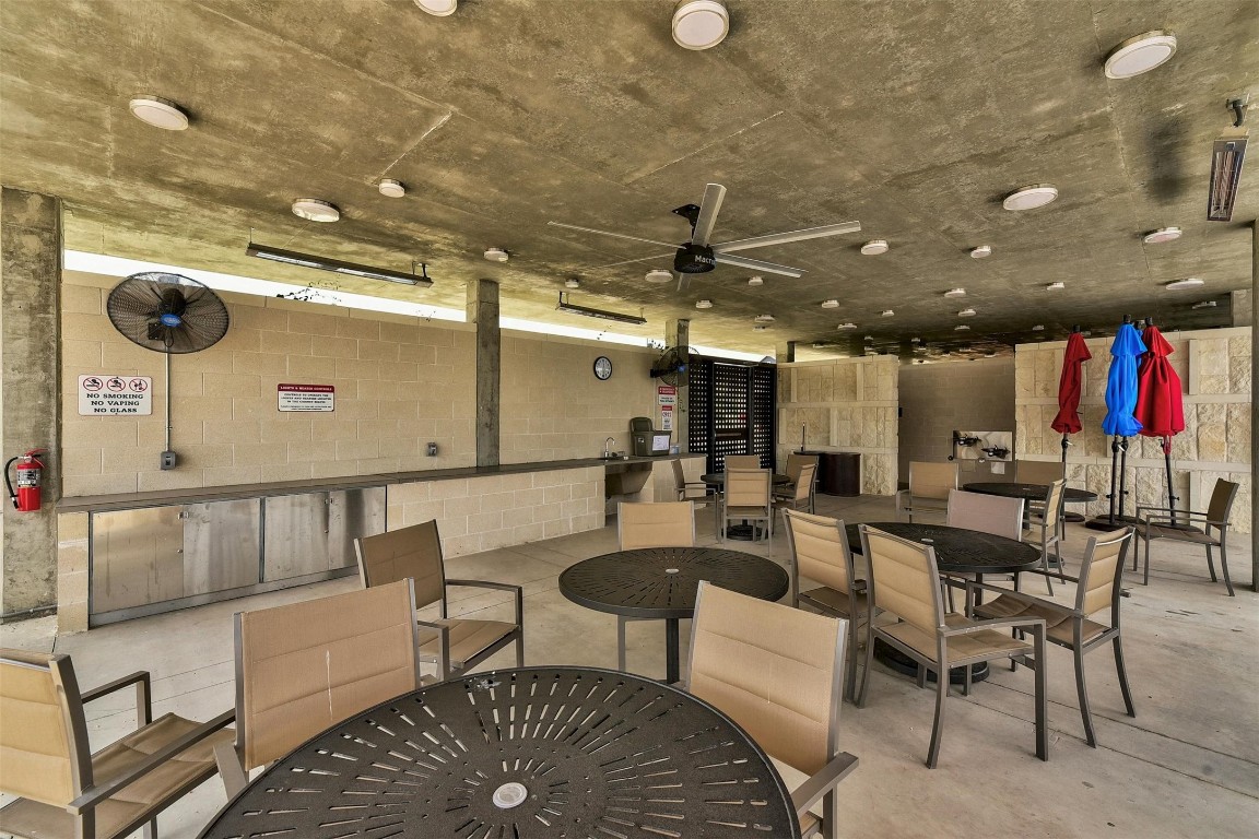 5913 B Charles Merle Dr., Unit 16 Austin, TX 78747 - Photo 34 of 35 a living room with lots of furniture and view of kitchen