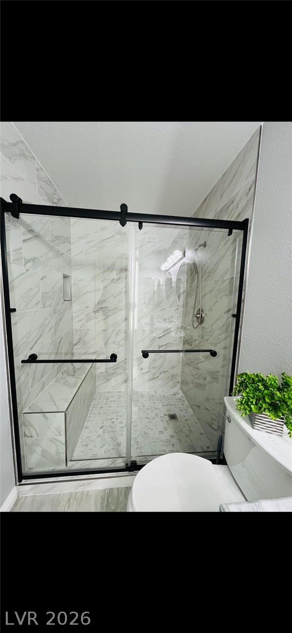 5131 South Lindell Road, Unit 205 Las Vegas, NV 89118 - Photo 16 of 22 Full bath featuring a stall shower and toilet
