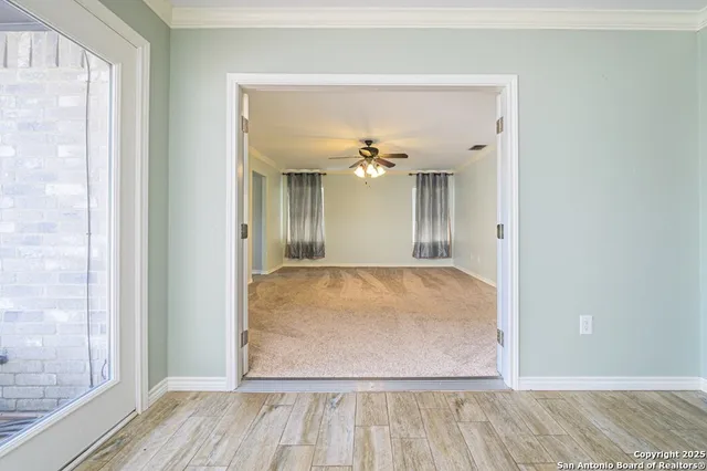 a view of an empty room with a window
