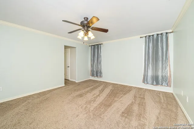 a bathroom with a granite countertop sink a mirror and shower