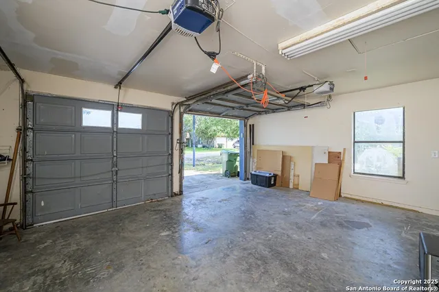 a view of a porch with furniture and garden
