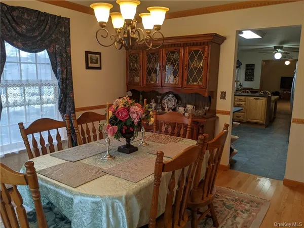 a view of a dining room with furniture and window
