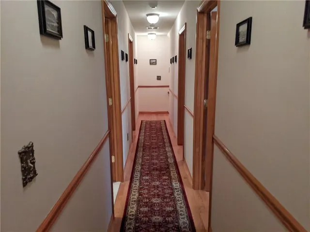 a view of a hallway with a stairs