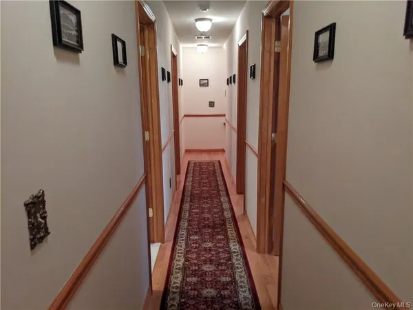 a view of a hallway with a stairs