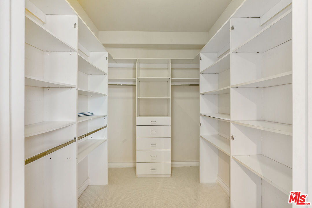 1747 South Barrington Avenue, Unit 103 Los Angeles, CA 90025 - Photo 31 of 45 a view of walk in closet with empty racks