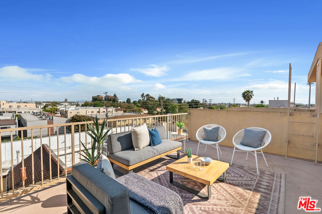 1747 South Barrington Avenue, Unit 103 Los Angeles, CA 90025 - Photo 33 of 45 a view of a terrace with furniture