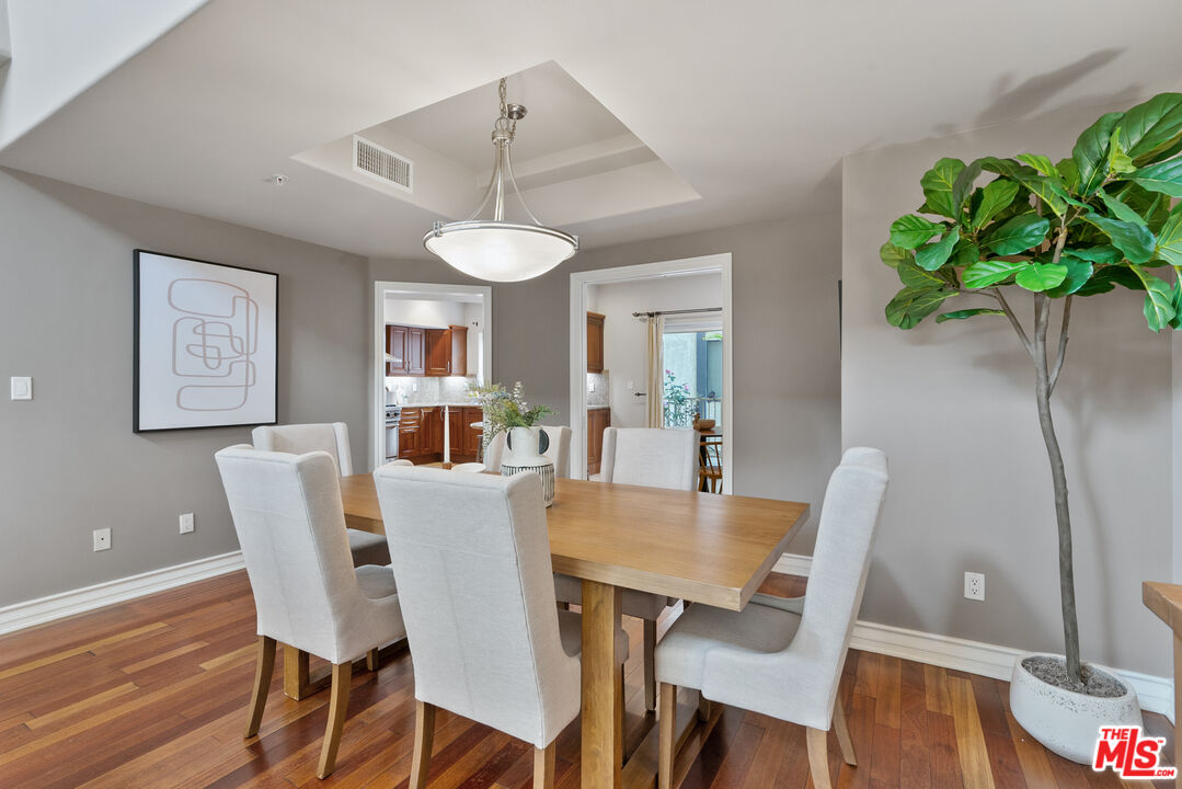 1747 South Barrington Avenue, Unit 103 Los Angeles, CA 90025 - Photo 7 of 45 a view of a dining room with furniture window and wooden floor