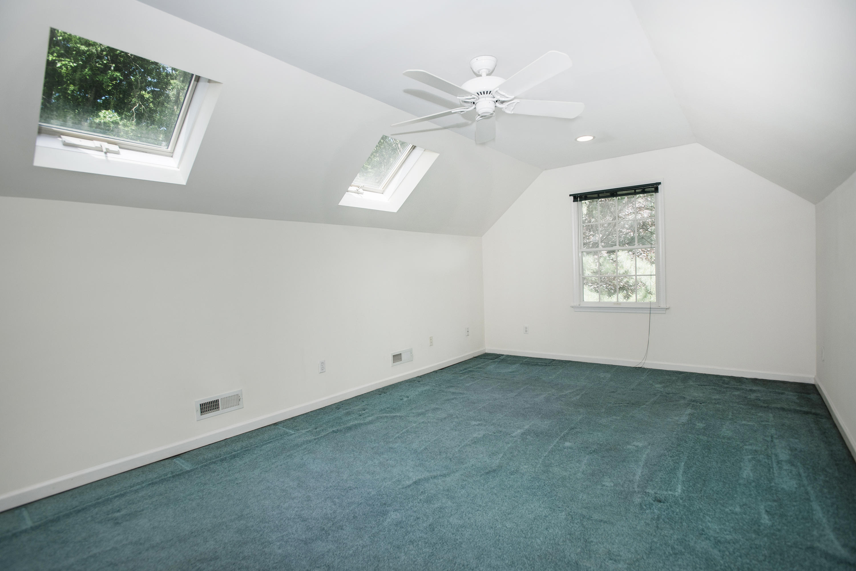 17 Getner Trail, Unit 17 Norwalk, CT 06854 - Photo 20 of 33 an empty room with windows and fan