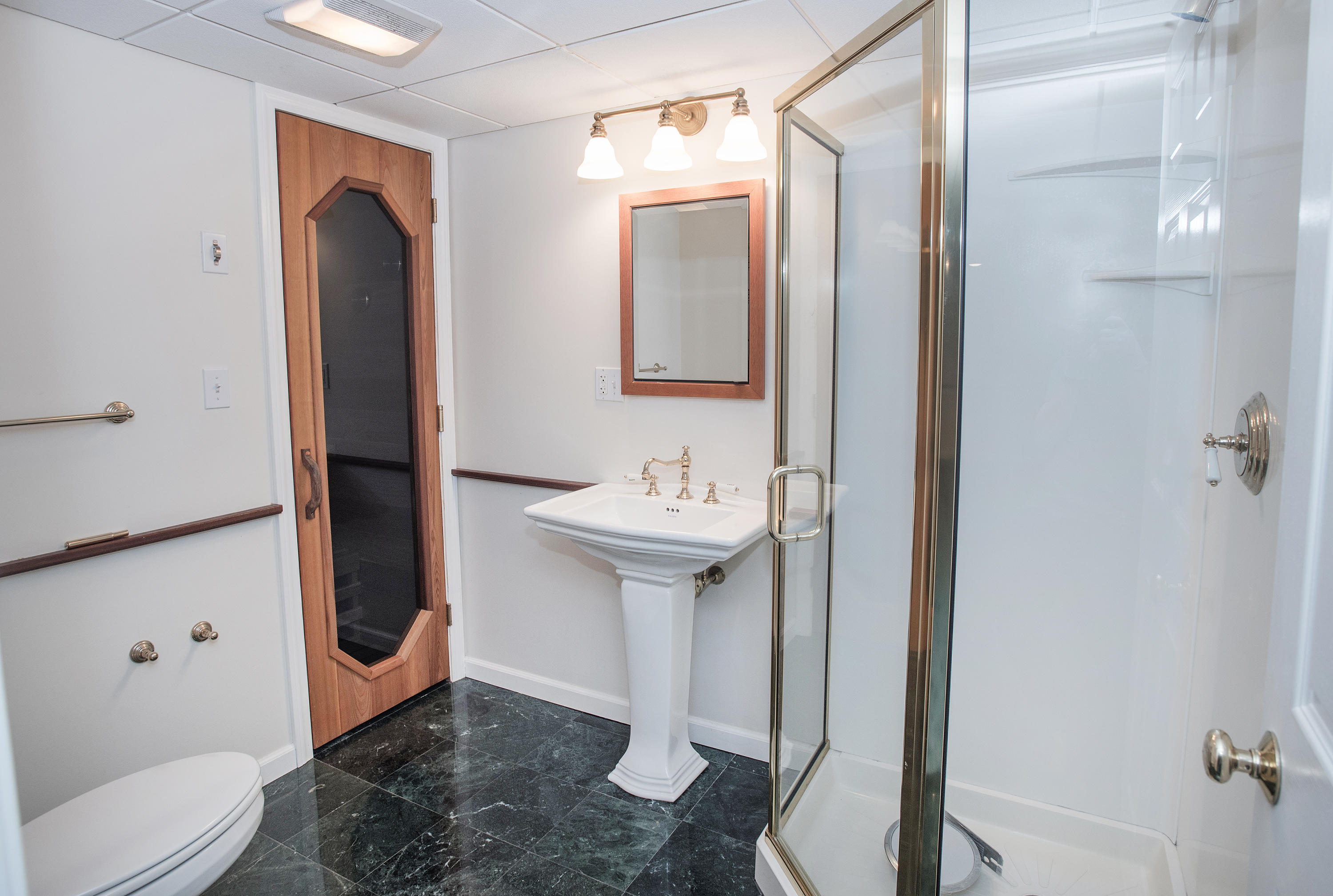 17 Getner Trail, Unit 17 Norwalk, CT 06854 - Photo 23 of 33 a bathroom with a sink a toilet and shower