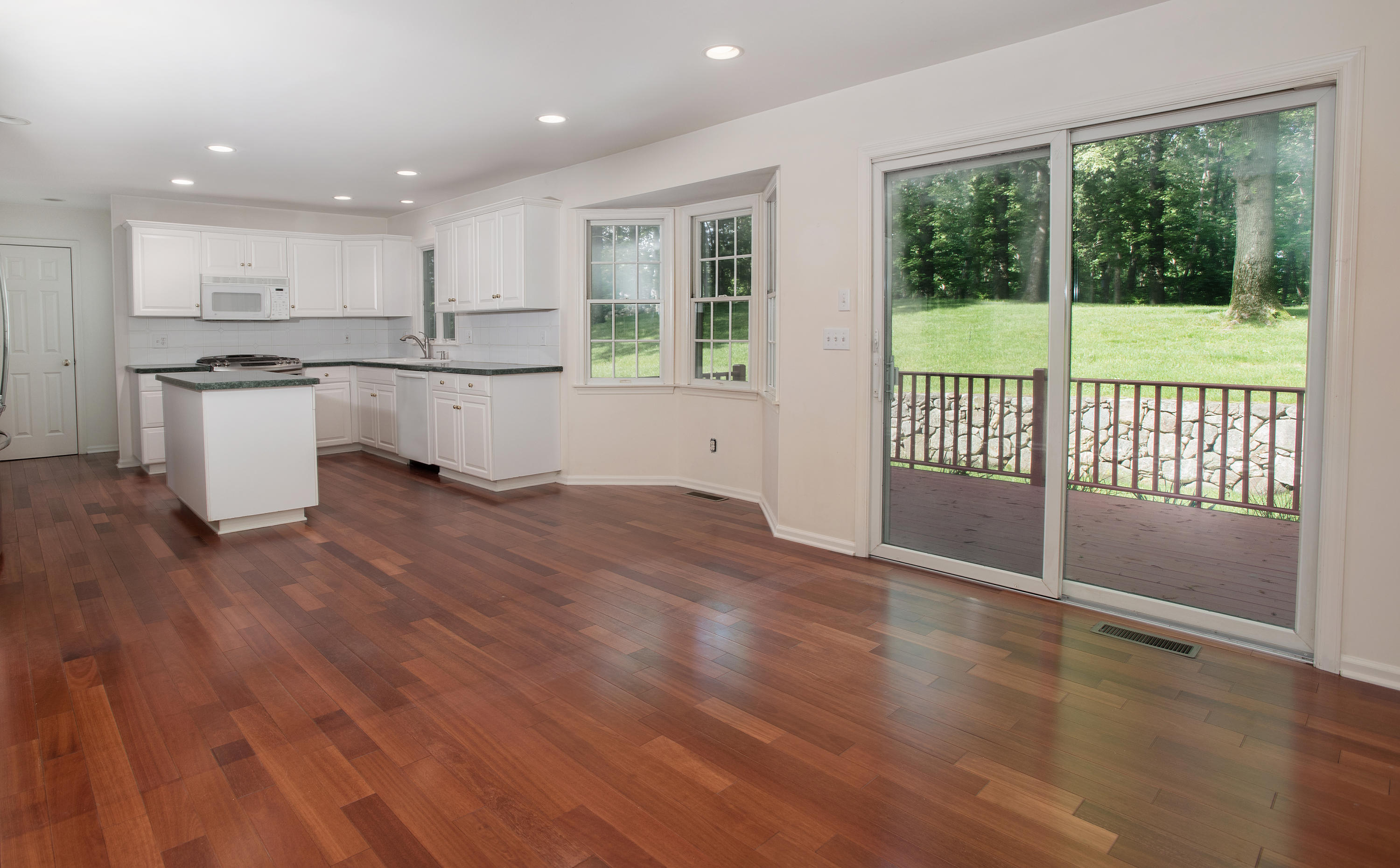17 Getner Trail, Unit 17 Norwalk, CT 06854 - Photo 9 of 33 a view of kitchen with kitchen island wooden floor and window