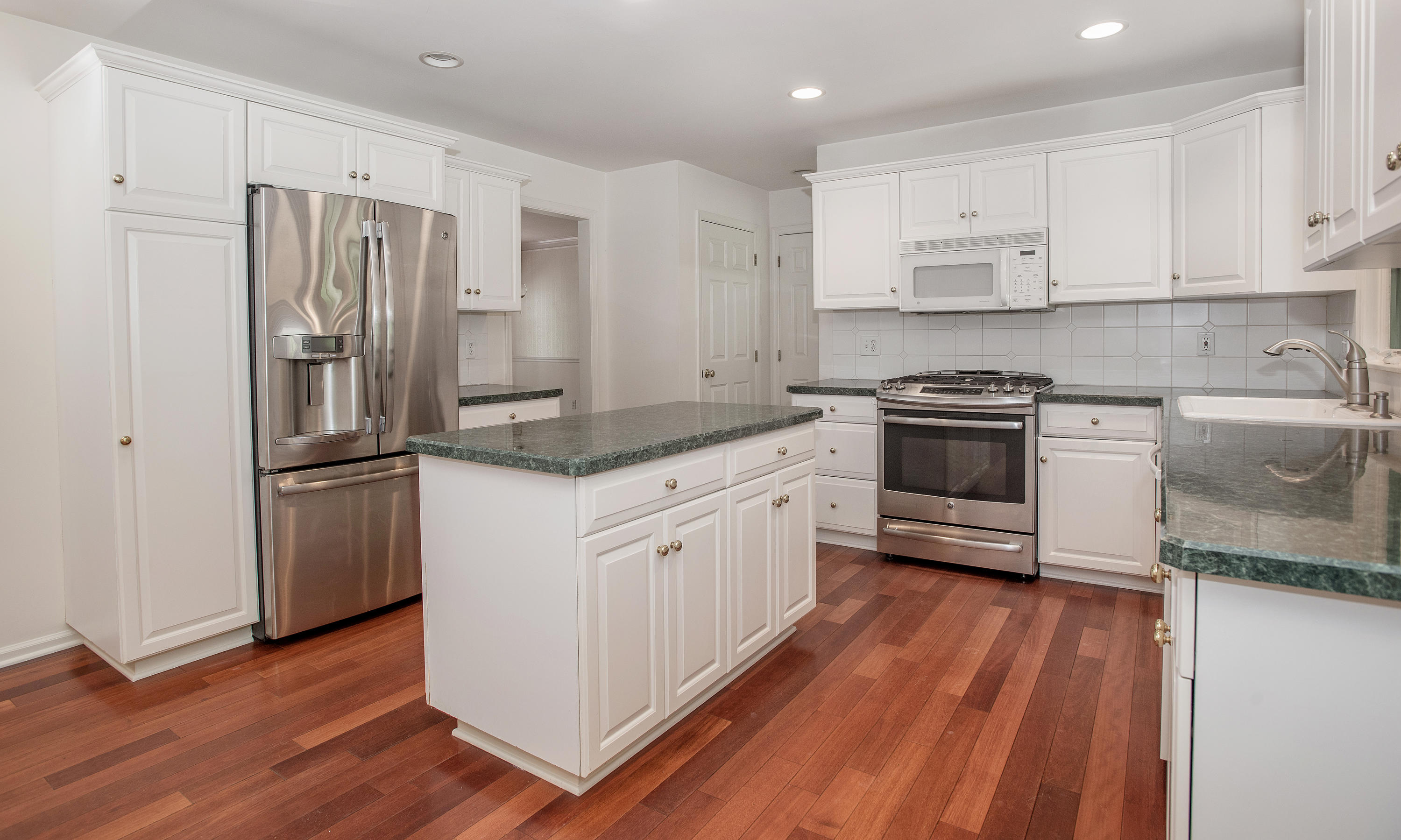 17 Getner Trail, Unit 17 Norwalk, CT 06854 - Photo 10 of 33 a kitchen with granite countertop stainless steel appliances a sink and refrigerator