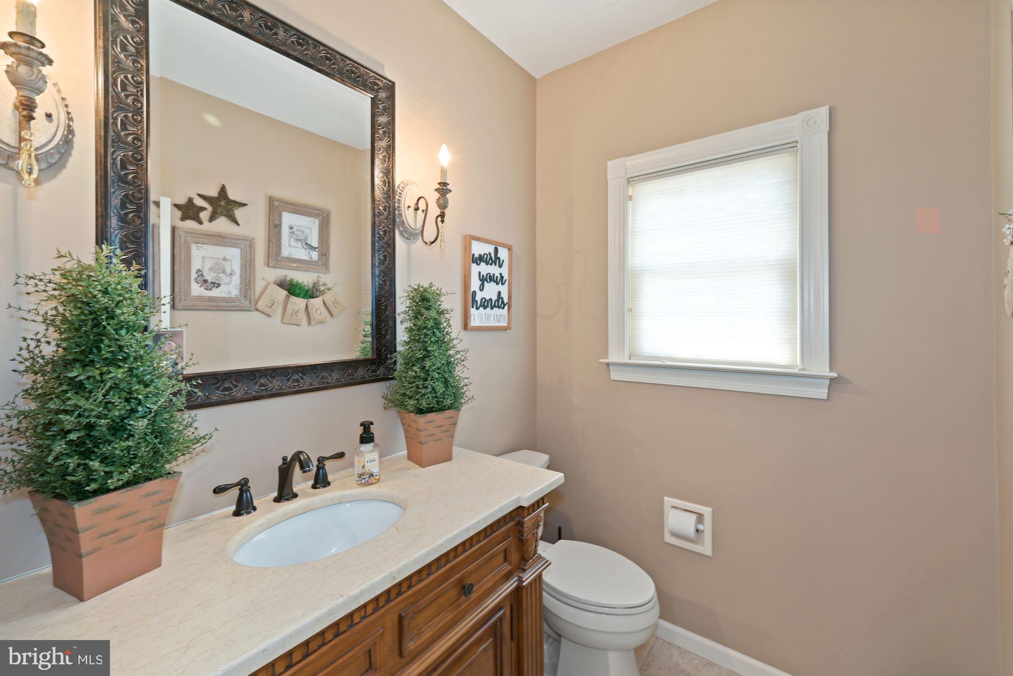 360 Chapel Heights Road Sewell, NJ 08080 - Photo 29 of 58 a bathroom with a granite countertop sink toilet a mirror and a window