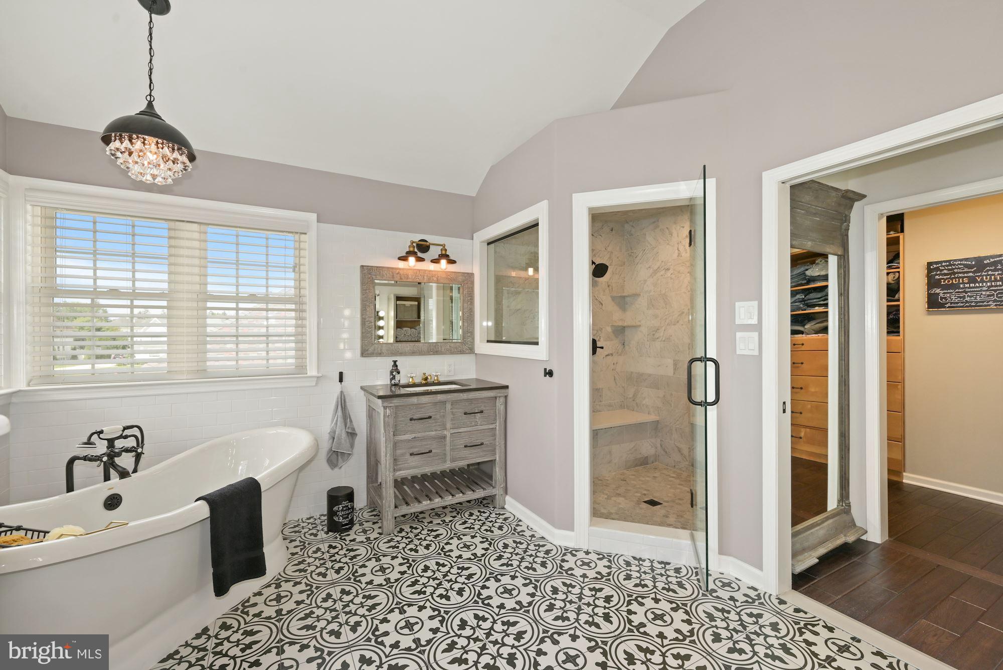 360 Chapel Heights Road Sewell, NJ 08080 - Photo 33 of 58 a spacious bathroom with a granite countertop sink a mirror a bathtub and next to a window