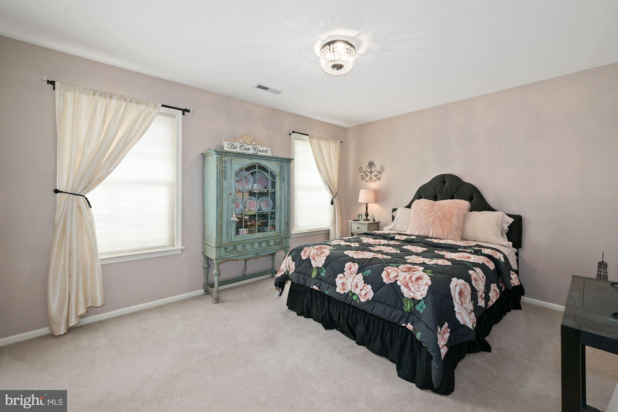 360 Chapel Heights Road Sewell, NJ 08080 - Photo 34 of 58 a bed sitting in a bedroom next to a window