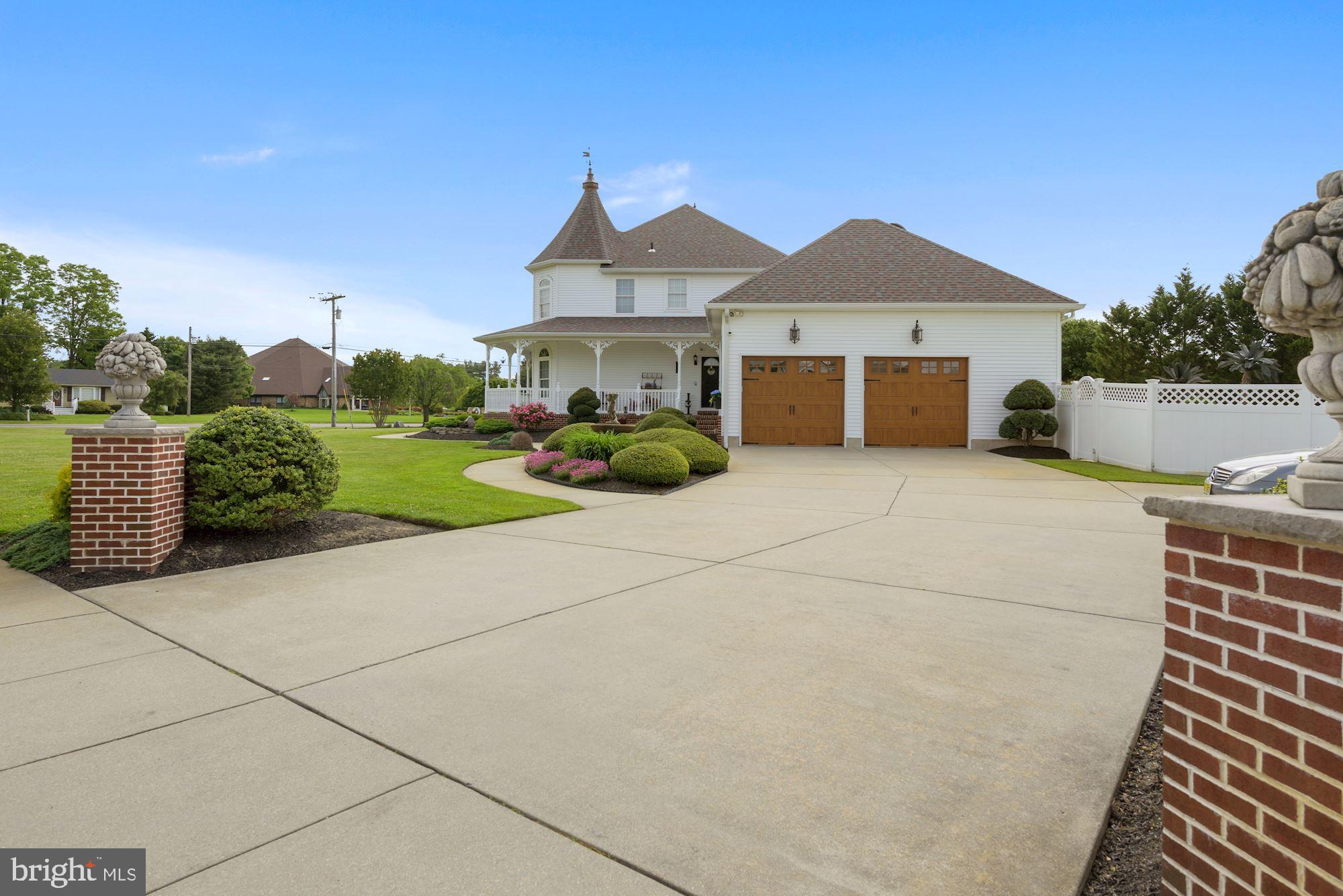 360 Chapel Heights Road Sewell, NJ 08080 - Photo 6 of 58 a front view of a house with a yard and garage