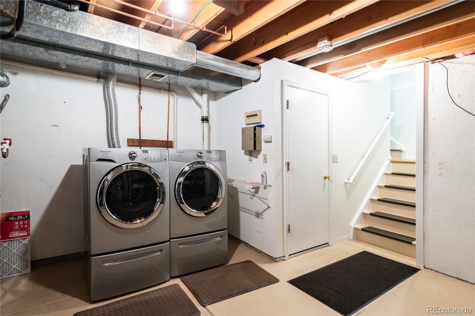 155 Blue Spruce Court Highlands Ranch, CO 80126 - Photo 23 of 29 a utility room with dryer and washer
