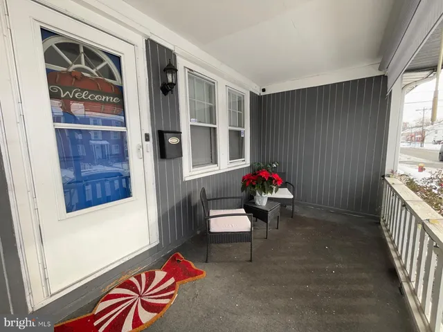 a living room with furniture and a gate