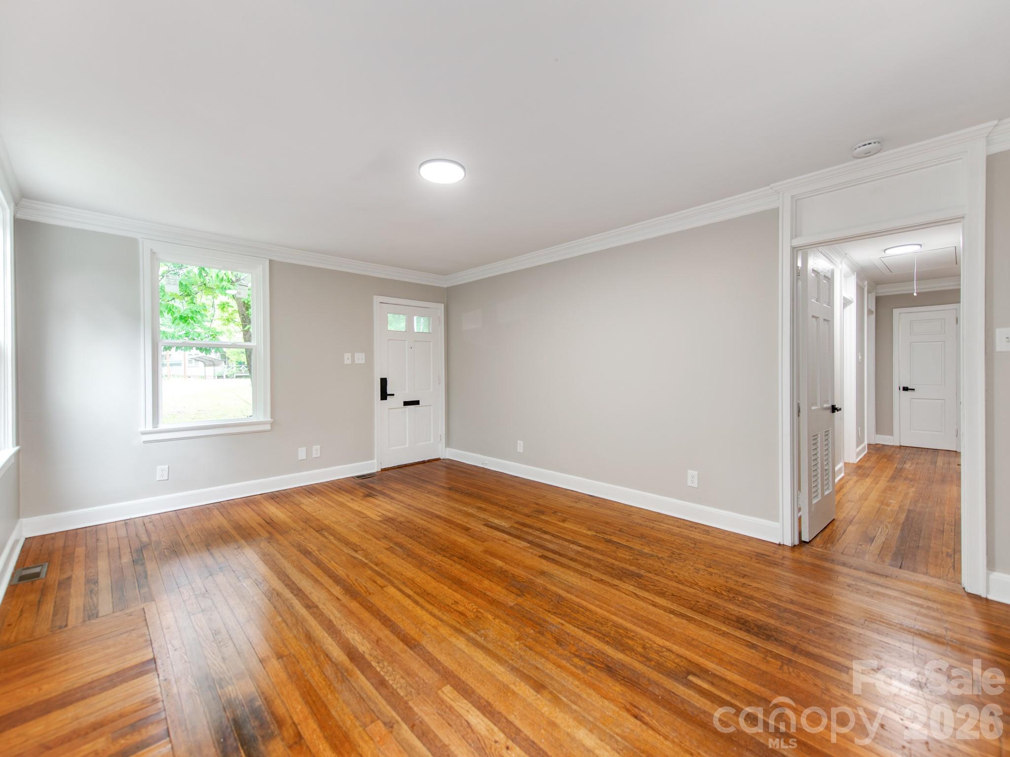 4699 Cherrystone Road Lancaster, SC 29720 - Photo 6 of 28 wooden floor in an empty room with a window