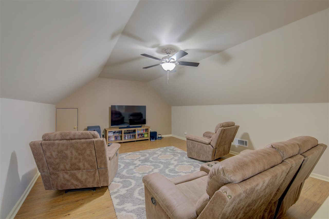 9162 Fox Ridge Road Germantown, TN 38139 - Photo 12 of 25 a living room with furniture and a flat screen tv
