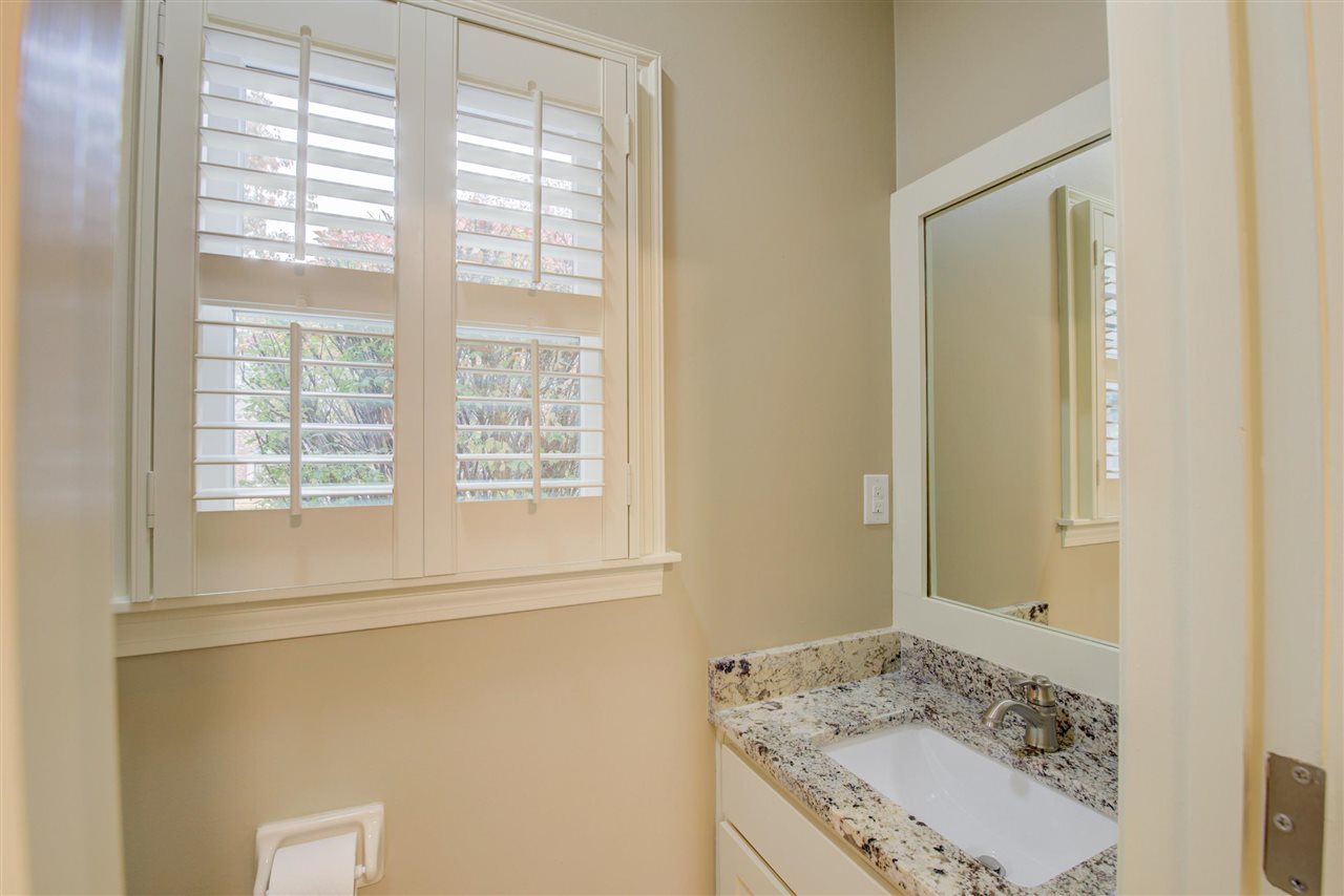9162 Fox Ridge Road Germantown, TN 38139 - Photo 13 of 25 a bathroom with a granite countertop sink and a window