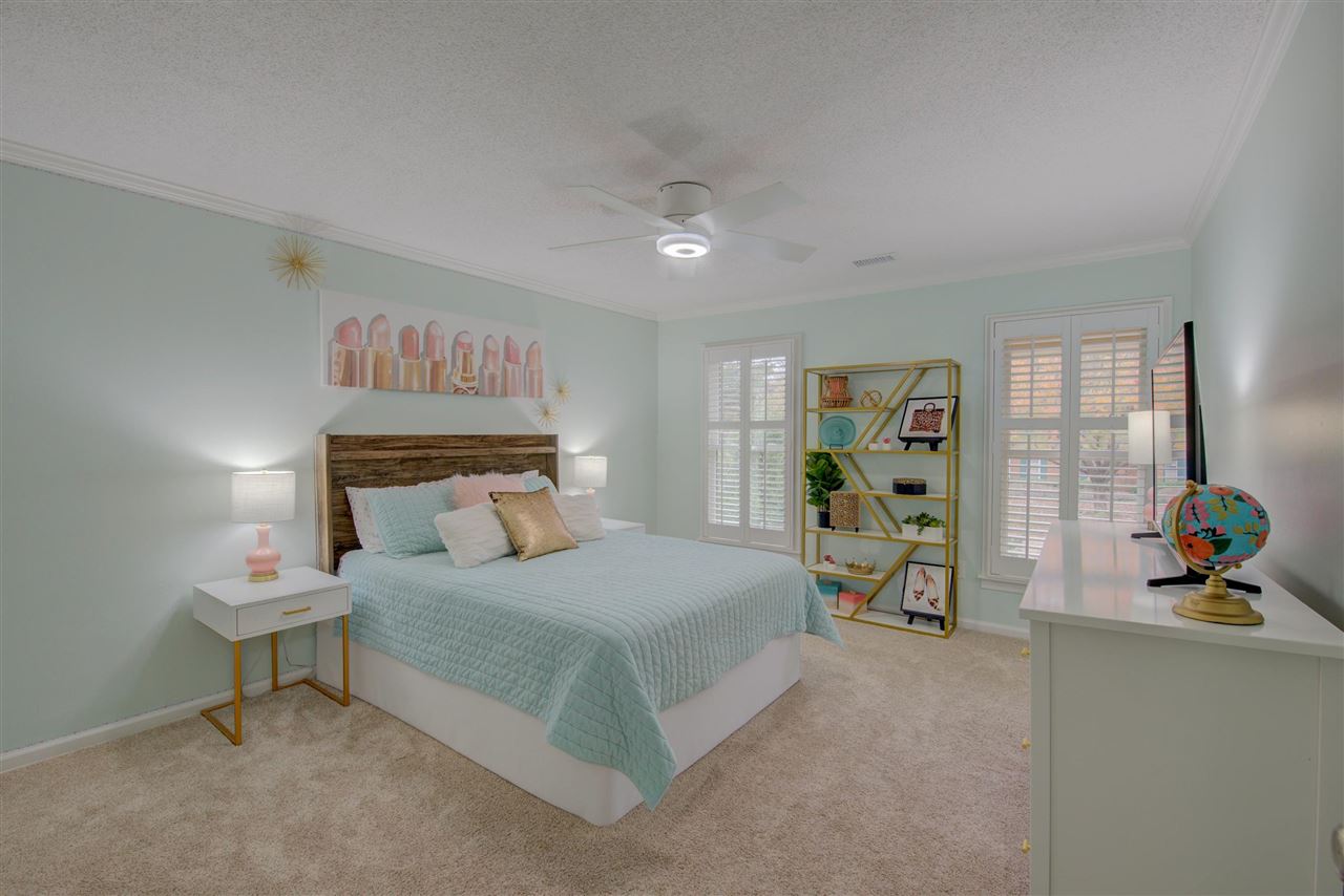 9162 Fox Ridge Road Germantown, TN 38139 - Photo 20 of 25 a bedroom with a bed and a potted plant