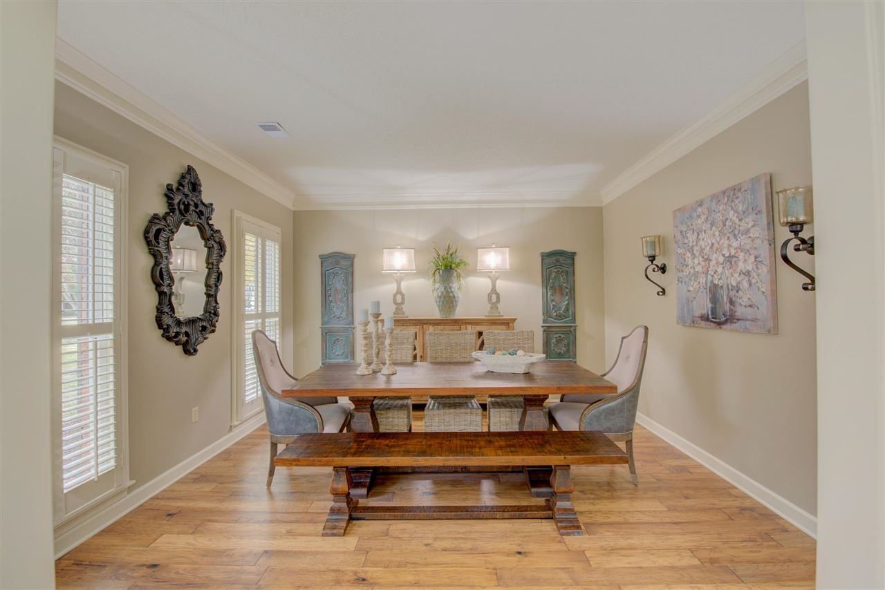 9162 Fox Ridge Road Germantown, TN 38139 - Photo 3 of 25 a dining room with furniture a rug and wooden floor