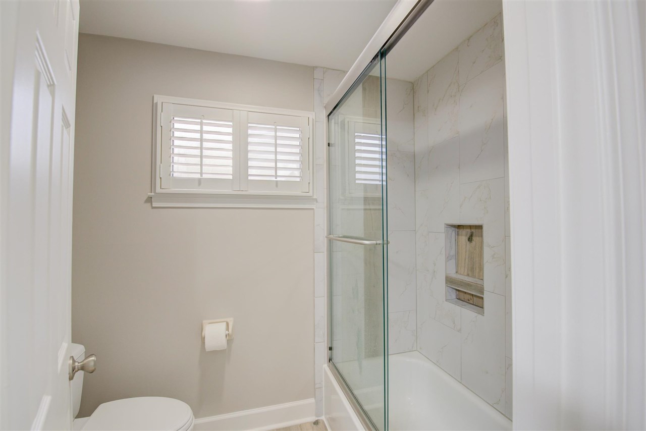 9162 Fox Ridge Road Germantown, TN 38139 - Photo 22 of 25 a bathroom with a toilet and a shower