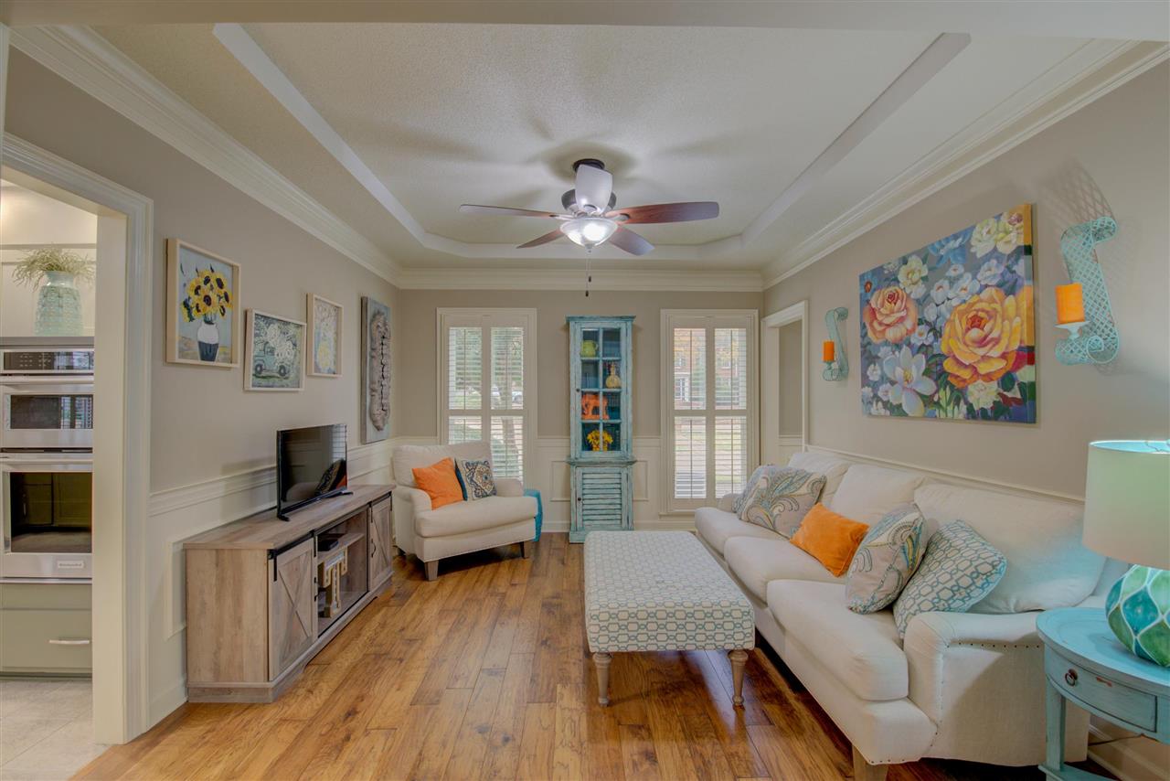 9162 Fox Ridge Road Germantown, TN 38139 - Photo 5 of 25 a living room with furniture and a flat screen tv