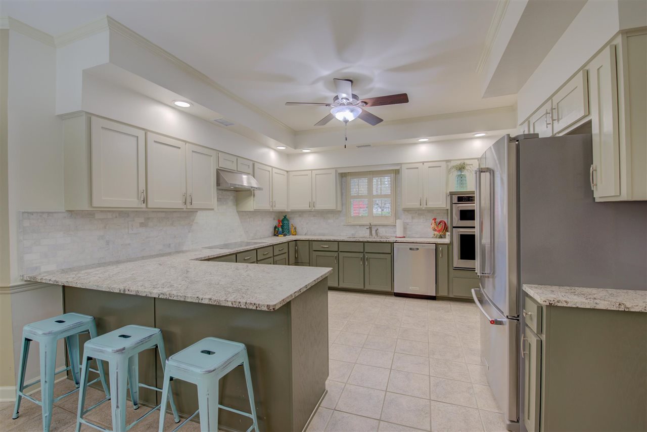 9162 Fox Ridge Road Germantown, TN 38139 - Photo 6 of 25 a kitchen with a chandelier a sink and cabinets