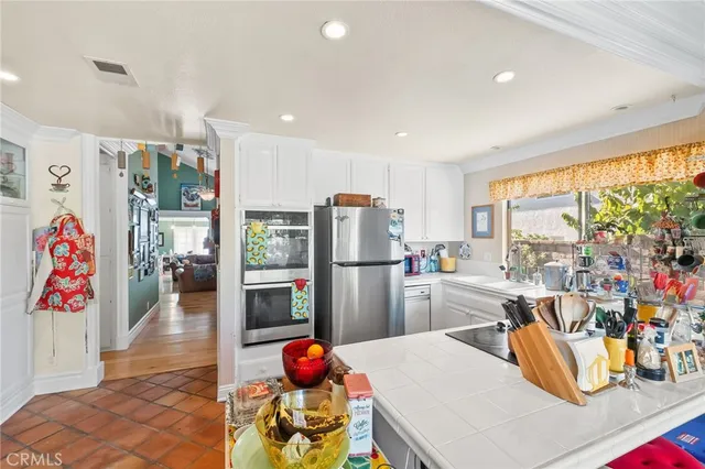 a bathroom with a sink vanity mirror and toilet