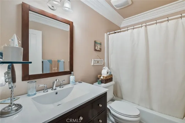 a bathroom with a granite countertop shower and a sink