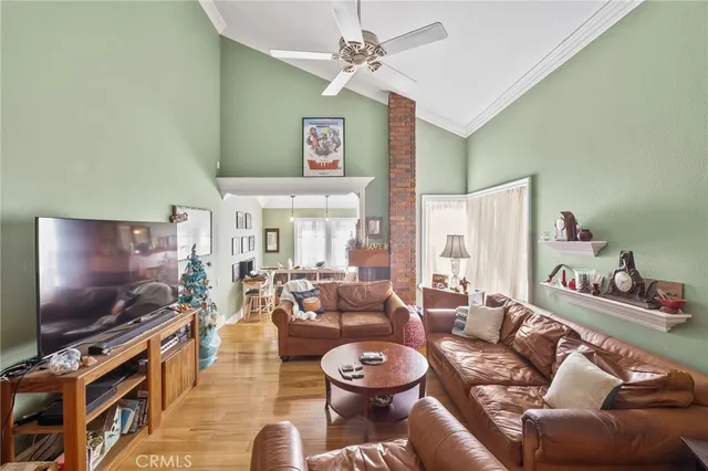 a living room with furniture and flowers